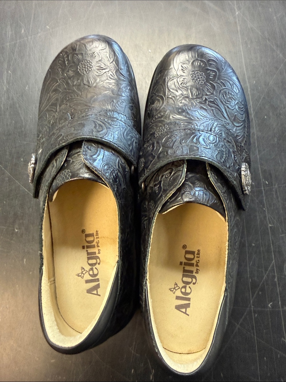 Alegria Black Embossed Floral Slip-On Clogs